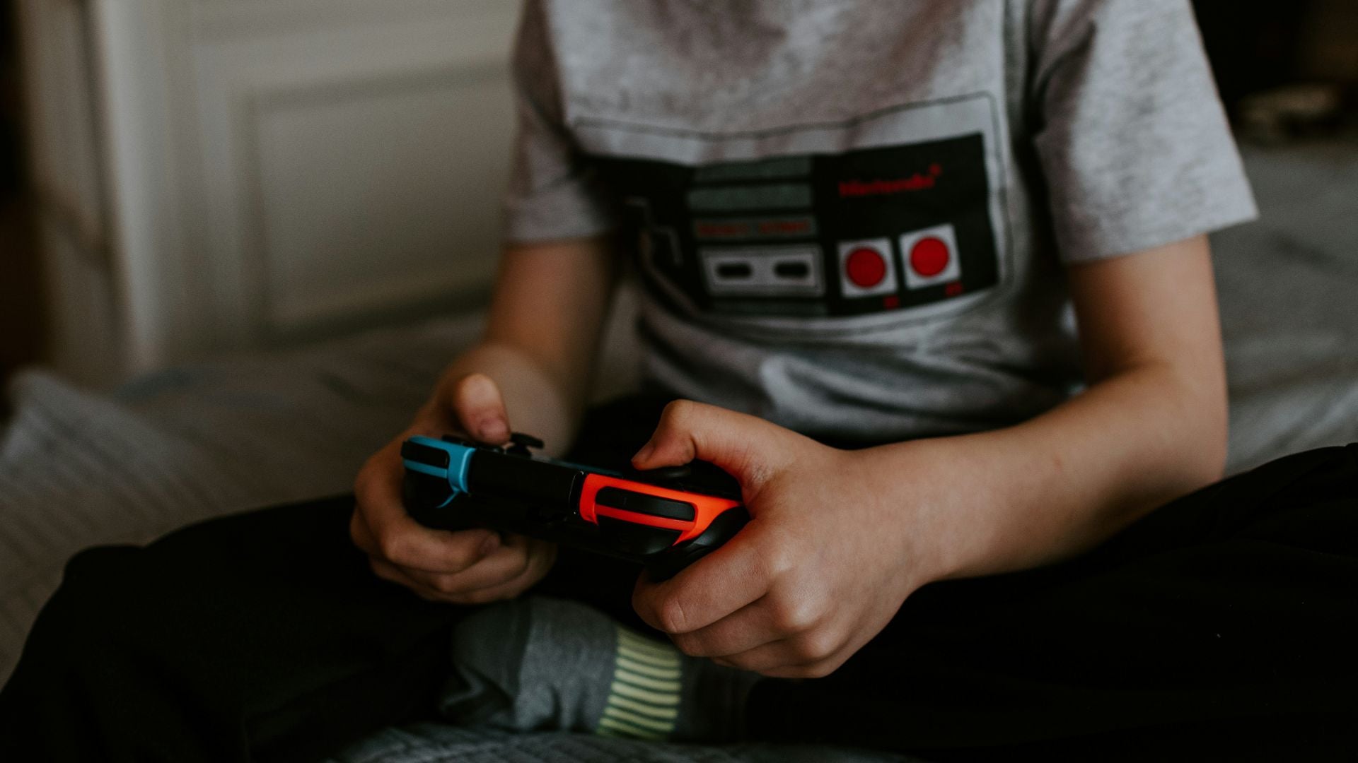 Boy playing video games on the Switch console choosing a Skin