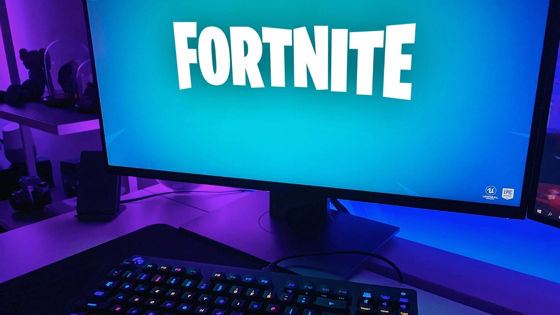 Computer setting of a child with Fortnite video game displayed