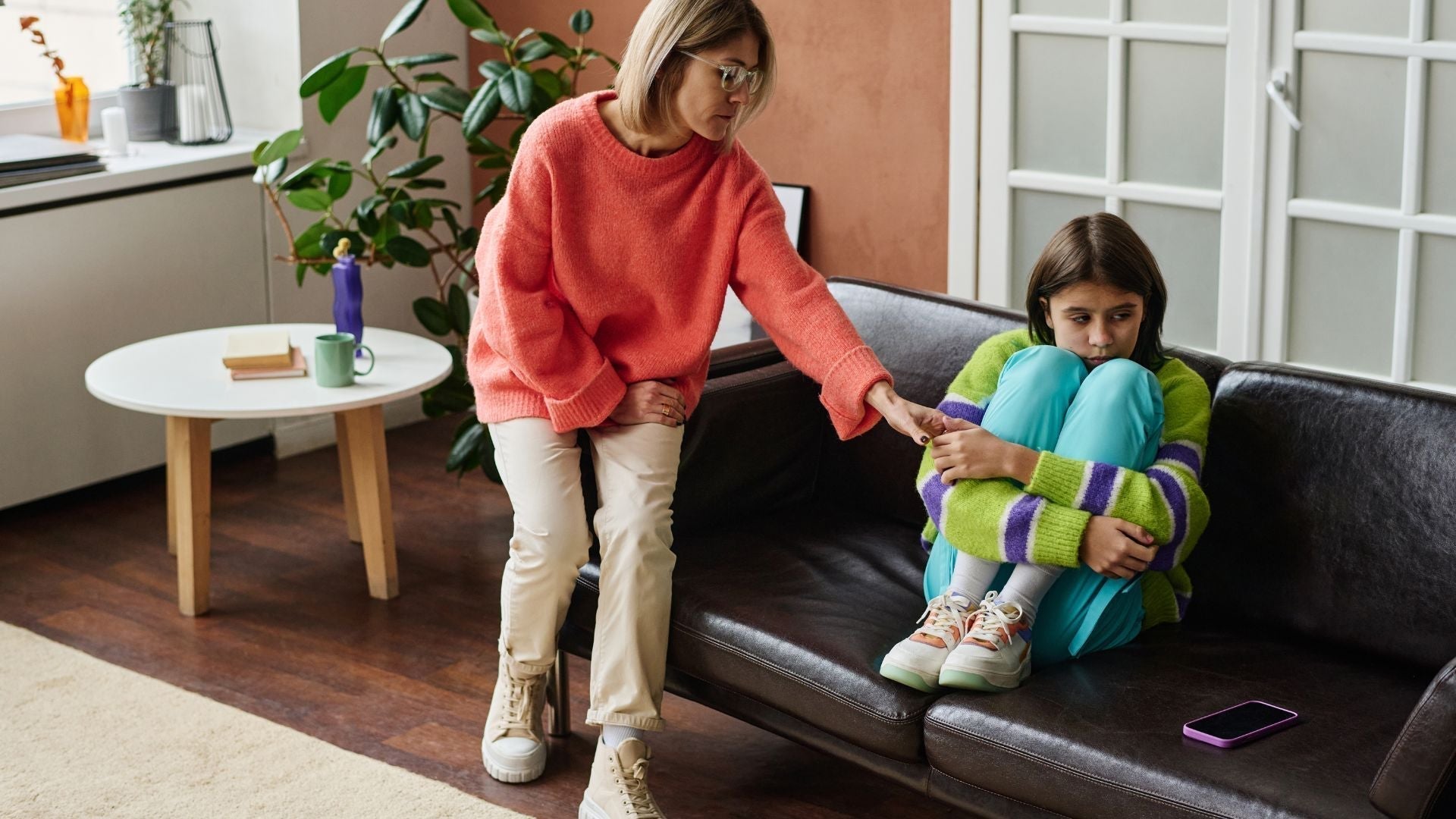 Mom reaching out to her kid to discuss cyberbullying